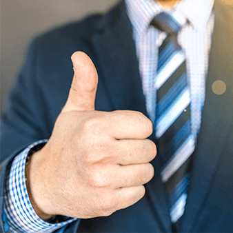 Man in suit with a thumbs up.